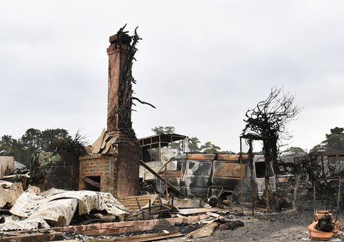 The burnt out remains of a house is seen from a bushfire in the Southern Highlands town of Wingello, 160km south west of Sydney