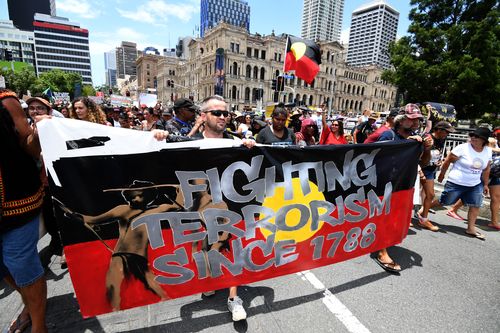 'Invasion Day' protesters take to the streets in Brisbane last year. (AAP)