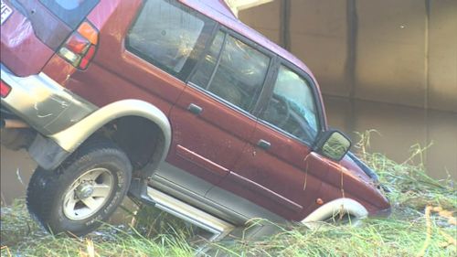 Police said it appeared the two vehicles followed one another through the floodwaters. (9NEWS)