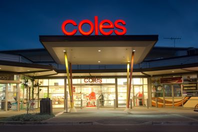 Sydney, Australia - July 25, 2013: The entrance to a brightly lit Coles supermarket in Ropes Crossing at dusk.