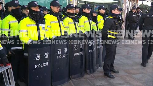 About 100 police officers were on hand to break up the demonstration. (9NEWS)