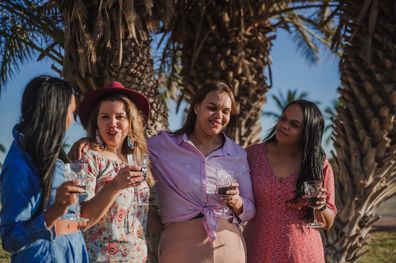 Happy women, group of friends smiling and talking