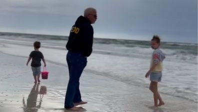 Grandpa with grandkids on the beach