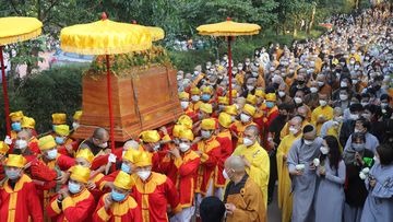 Coffin of Vietnamese renowned monk Thich Nhat Hanh is carried to the street during his funeral.