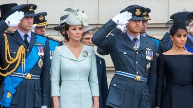 Fea0084046.DT News, Rota. Buckingham Palace. Centenary of the Royal Airforce. HM The Queen presents The RAF with new Queen's Colours of their centenary. Then watches with other members of the Royal Family a ply past