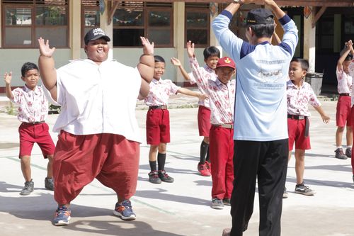 Arya Permana exercising at school with classmates in Karawang, West Java, Indonesia, March 2017 (Channel 5 / Barcroft Productions / Barcroft Media via Getty Images)