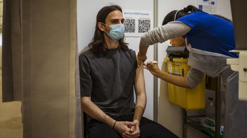 Alexander Sartor gets vaccinated at the Showgrounds Vaccination Clinic, Melbourne.