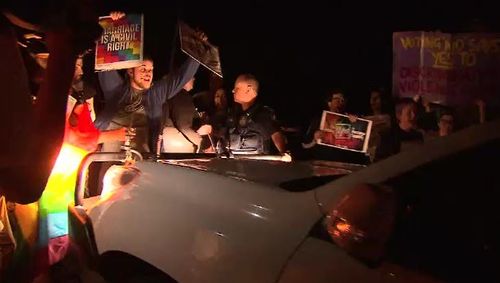 The protest became violent. (9NEWS)