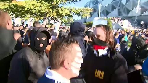 Victoria Police said football fans who cover their faces portray an image more aligned to criminals. (9NEWS)