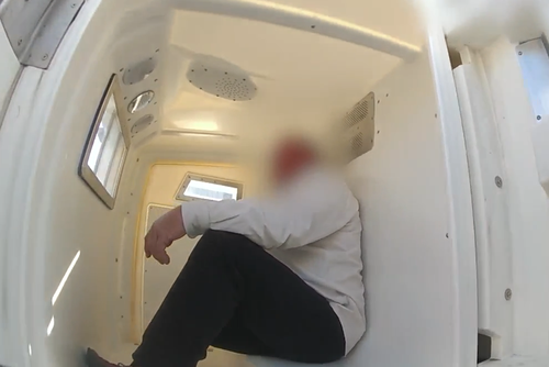 A 59-year-old man in police custody after being arrested for allegedly assaulting a crew member before a flight from Perth to Brisbane took off.