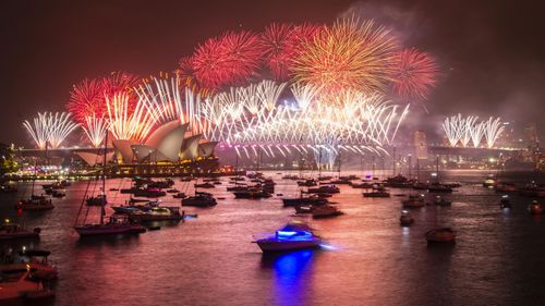 Fireworks explode over the Sydney Harbour Bridge and Sydney Opera House during the midnight display during New Year's Eve celebrations on January 01, 2020 in Sydney, Australia