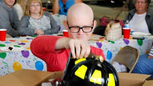 Jacob was also presented with his first real firefighter helmet at the party. (West Hempfield Fire/Rescue)