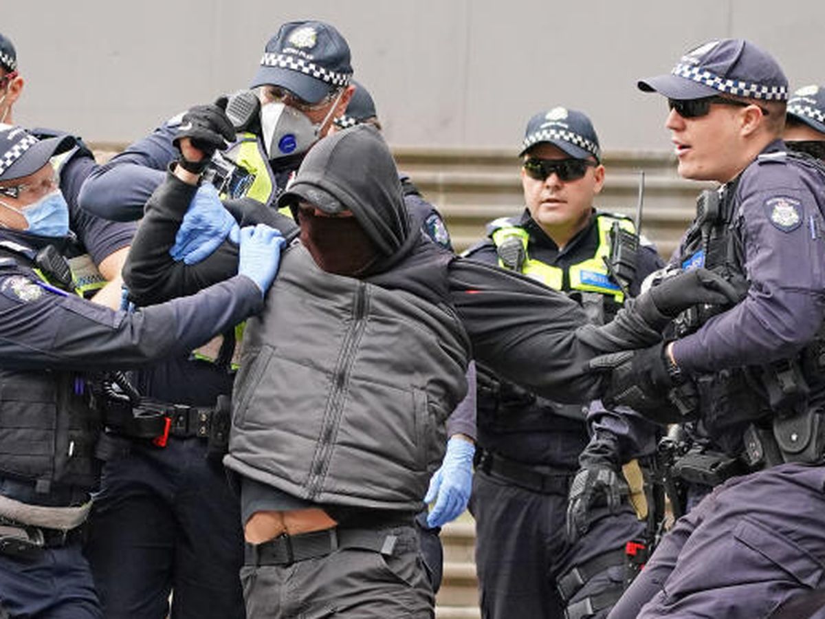 Melbourne, Australia. 5th Aug, 2021. Police give chase to protesters up Collins  Street during a snap protest called on the eve of the 6th lockdown to be  imposed on Melbourne. Hardcore anti-lockdown