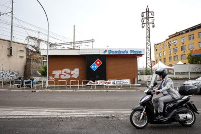 A "For Sale" banner outside a closed-down Domino's Pizza Inc. store in Rome, Italy, on Tuesday, Aug. 9, 2022. 