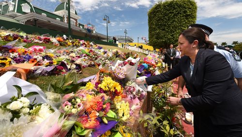 Mourners pay tribute to the four victims in the Dreamworld disaster.