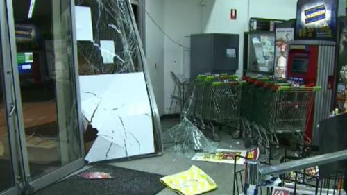 A security guard was struck by a line of shopping trolleys. (9NEWS)