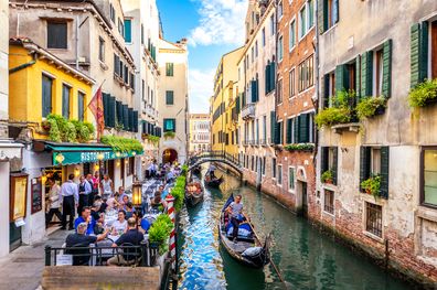 Venice, Italy  August 13, 2017: Gondola Sailing in the Venetian Canals with tourist