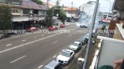 The driver was filmed swerving between cars on Bay Street in broad daylight. (9NEWS)