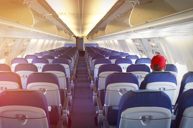 Empty airplane with just one passenger on the board