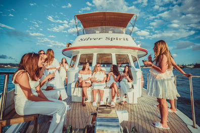 Spirit Fleet Silver Spirit charter boat company: People wearing white enjoying a private cruise on the harbour