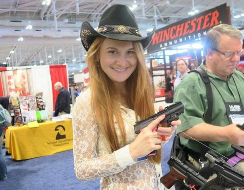 Mariia Butina poses with a pistol at a gun show. (Facebook)