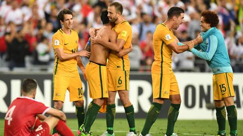 Australia celebrate their win over Syria in the 2018 World Cup qualifying football match between Australia and Syria at Stadium Australia in Sydney. 