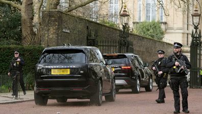 A convoy of cars believed to be carrying Prince Harry arrive at Clarence House following the announcement of King Charles III's cancer diagnosis, in London, Tuesday, Feb. 6, 2024