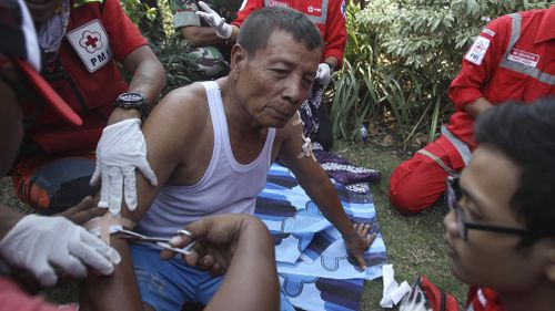 In the aftermath of the blasts, paramedics were seen attending to the wounded in the streets. Picture: AAP.