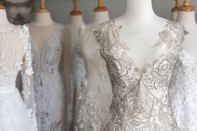 Wedding Dresses On Mannequins In Fashioner Designer's Studio. Home based business.