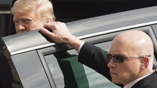 Donald Trump with Secret Service agent.