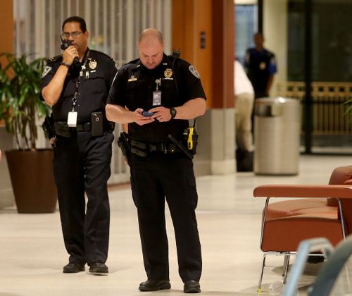 Police cleared out the area around Concourse B of Louis Armstrong International Airport after a machete-wielding man was shot by a TSA employee in New Orleans. (AAP)