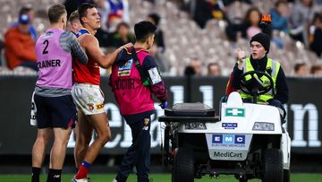 Hugh McCluggage is seen injured against Hawthorn.