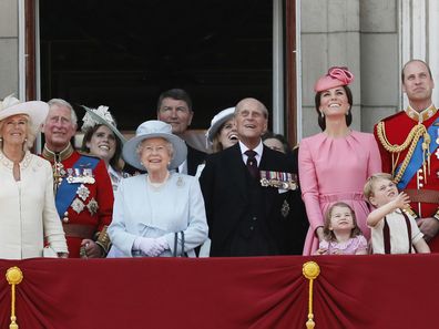 Members of Britain's Royal family from left, Camilla, the Duchess of Cornwall, Prince Charles, Princess Eugenie, Queen Elizabeth II, background Timothy Laurence, Princess Beatrice, Prince Philip, Kate, the Duchess of Cambridge, Princess Charlotte, Prince George and Prince William watch a fly past as they appear on the balcony of Buckingham Palace at Trooping the Colour