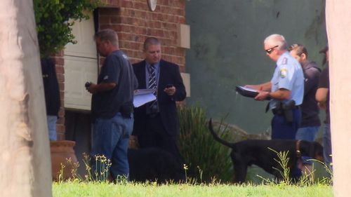 Firearm parts, drugs, and unauthorised reptiles were seized during this morning's raids. (9NEWS)