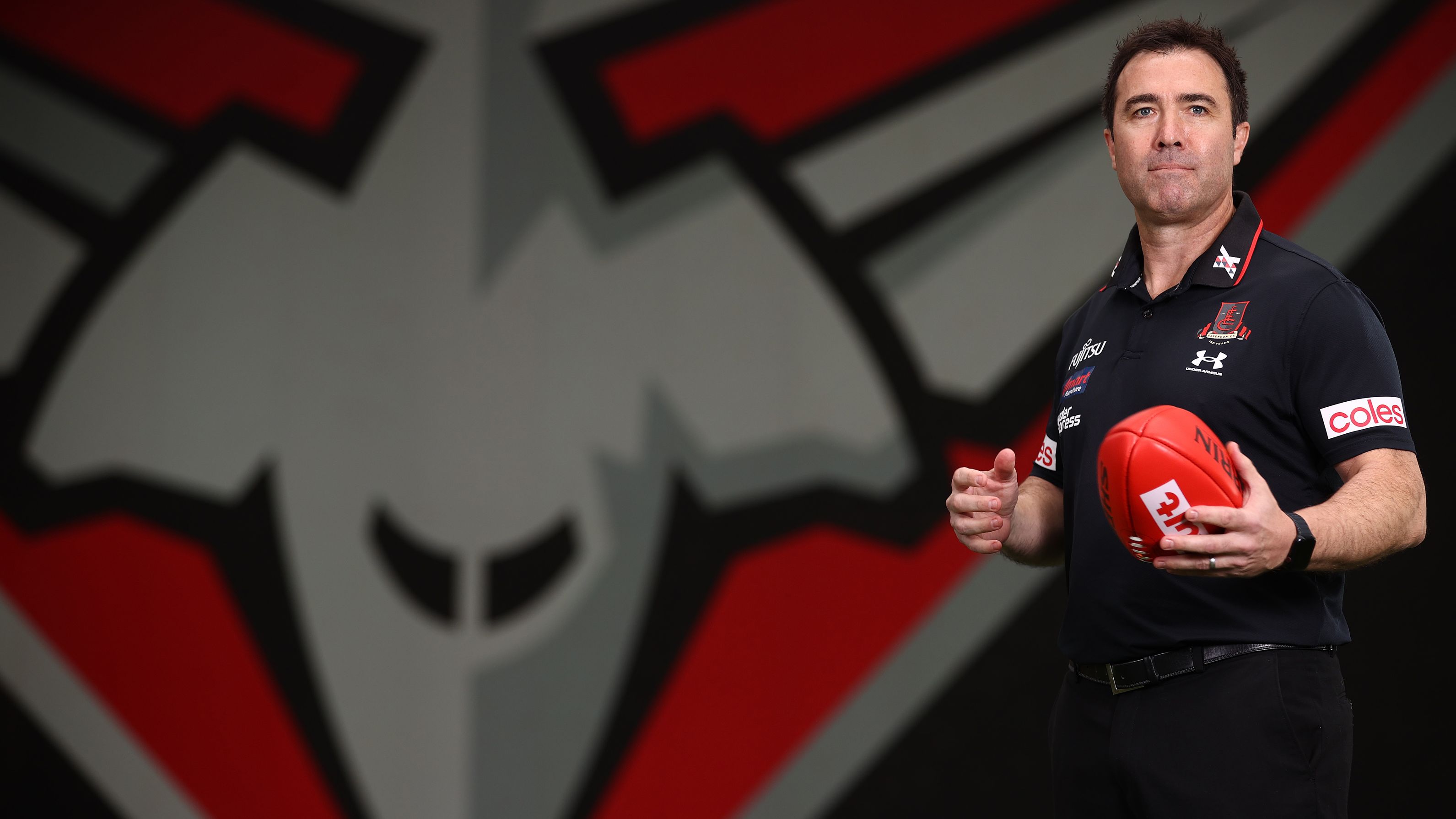 Brad Scott poses for the first time in black and red.