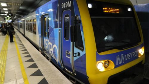 Woman charged over racist Melbourne train attack