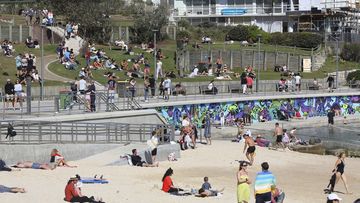 Crowds take in fine weather at Bondi Beach.