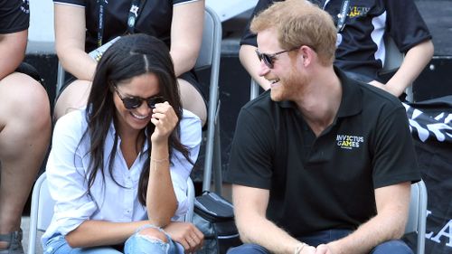 The couple sat side-by-side as they watched the wheelchair tennis semi-finals. 