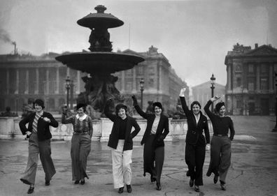 A group of models in Paris show off the city's latest trend, flared trousers, in February 1933.