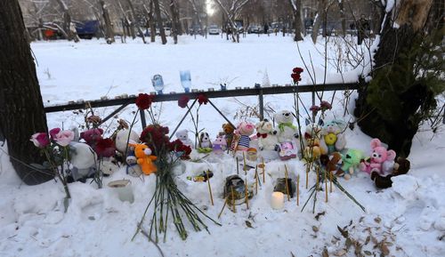 Toys, candles and flowers lie at the scene of a collapsed apartment building in Magnitogorsk, a city of 400,000 people, about 1,400 kilometers (870 miles) southeast of Moscow, Russia.