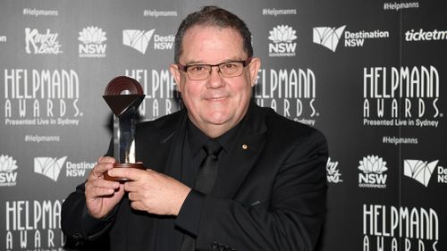 John Frost poses for a photograph with the award for Best Musical at the 17th Annual Helpmann Awards in Sydney on July 24, 2017. (AAP)