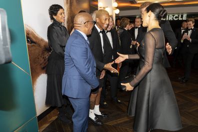 Meeting musician Pharrell Williams at the European Premiere of The Lion King. 