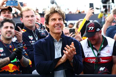 Tom Cruise applauds at the Podium celebrations  during the F1 Grand Prix of Great Britain at Silverstone on July 03, 2022 in Northampton, England. 