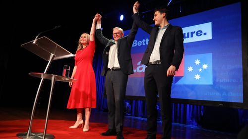 Labor Leader Anthony Albanese  his partner Jodie Haydon and his son Nathan Albanese celebrate victory during the Labor Party election night event at Canterbury-Hurlstone Park RSL Club.