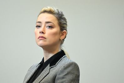 Actor Amber Heard stands in the courtroom at the Fairfax County Circuit Courthouse in Fairfax, Va., Tuesday, May 24, 2022.  