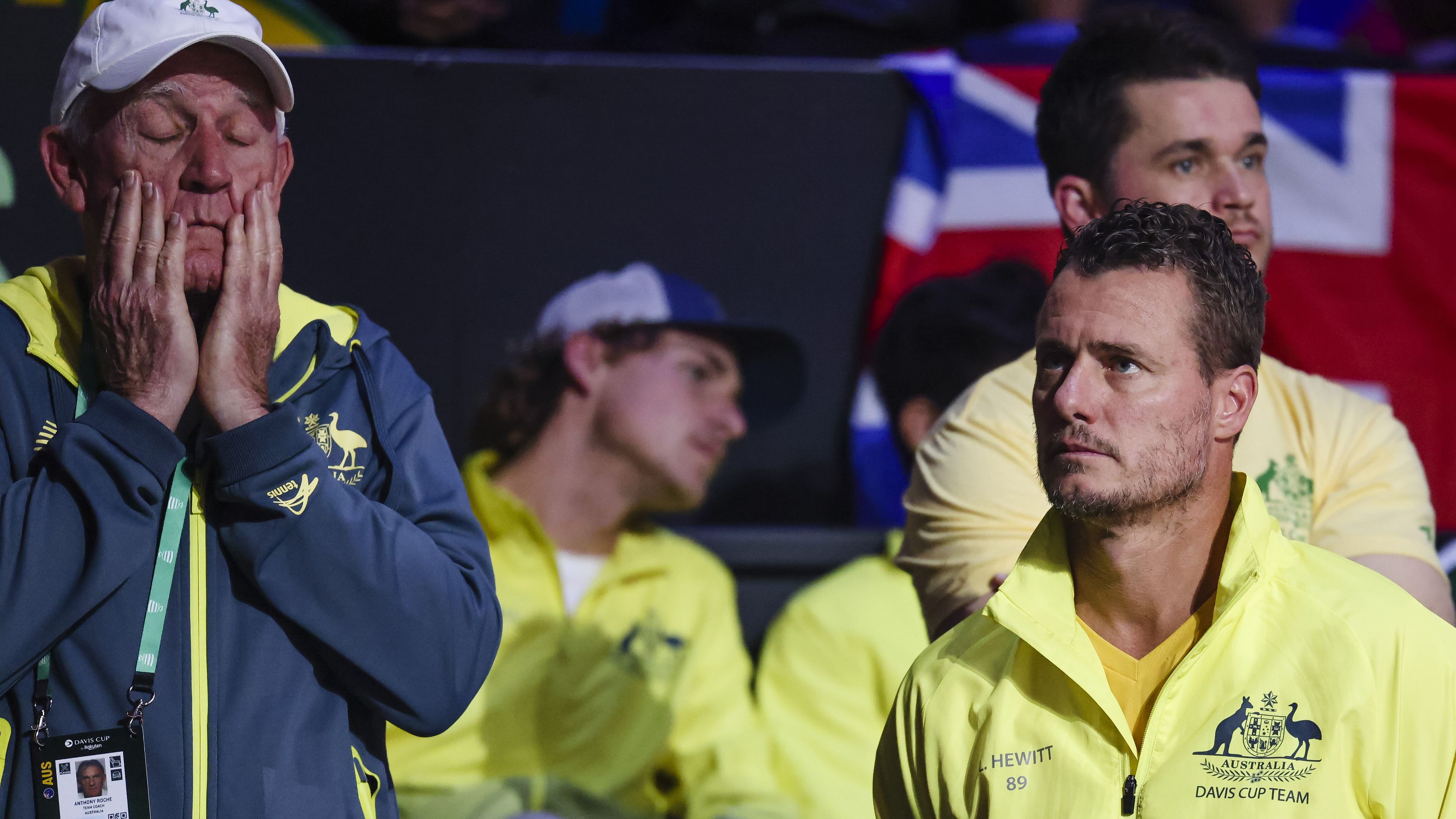 Australian team coach Anthony Roche (left) and team captain Lleyton Hewitt react after losing.