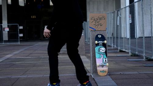 Skateboarders skate in front of city hall in remembrance of Tyre Nichols, who died after being beaten by Memphis police officers, five of whom have been fired, in Memphis, USA