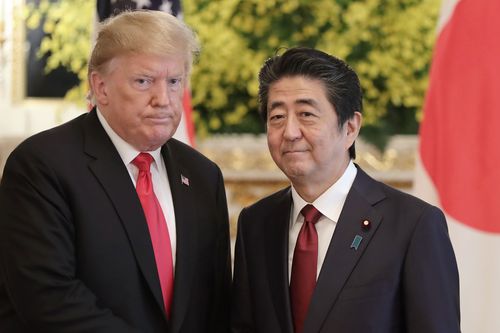 Former US President Donald Trump, left, and Japanese Prime Minister Shinzo Abe pose for a photo prior to their meeting at Akasaka Palace, Japanese state guest house, in Tokyo on May 27, 2019.
