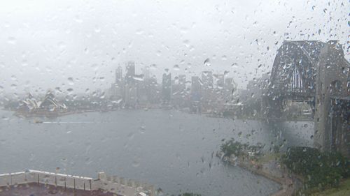 Sydney Harbour was hit by rain.