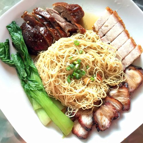 Hawker Chan is dishing up meals like this roast crispy pork and barbecue pork on noodles. (Facebook)